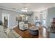 Bright and airy living room with hardwood floors, comfortable seating, and open floor plan at 725 High Vista Dr, Davenport, FL 33837