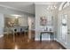 Open-concept living and dining area featuring gleaming hardwood floors and plenty of natural light at 725 High Vista Dr, Davenport, FL 33837