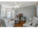 Comfortable living room featuring hardwood floors, neutral decor, and an inviting atmosphere at 725 High Vista Dr, Davenport, FL 33837