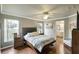 Inviting primary bedroom with hardwood floors, natural light, and ensuite bathroom at 725 High Vista Dr, Davenport, FL 33837