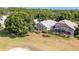 An aerial shot of the rear of a home featuring a screened lanai and well-maintained lawn at 7264 Hawksnest Blvd, Orlando, FL 32835