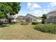 Residential backyard with a screened-in patio and green lawn at 7264 Hawksnest Blvd, Orlando, FL 32835