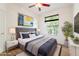 Comfortable bedroom with large window, grey color scheme, and stylish modern décor at 7264 Hawksnest Blvd, Orlando, FL 32835
