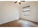 Bedroom with wood floors, ceiling fan, and window with blinds at 7264 Hawksnest Blvd, Orlando, FL 32835