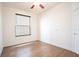 Bedroom with wood floor, ceiling fan, and window with blinds at 7264 Hawksnest Blvd, Orlando, FL 32835