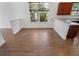 Cozy dining area with hardwood floors and a view of the lush greenery outside at 7264 Hawksnest Blvd, Orlando, FL 32835