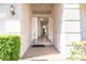 Inviting entryway with decorative lighting and spacious foyer and wood flooring at 7264 Hawksnest Blvd, Orlando, FL 32835