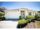Charming single-story home featuring a manicured lawn and a two-car garage at 7264 Hawksnest Blvd, Orlando, FL 32835