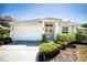 Charming single-story home featuring a manicured lawn and a two-car garage at 7264 Hawksnest Blvd, Orlando, FL 32835