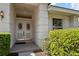 Elegant double front doors with decorative glass inserts and sidelights at 7264 Hawksnest Blvd, Orlando, FL 32835