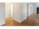 Spacious hallway features wood-look flooring and neutral walls at 7264 Hawksnest Blvd, Orlando, FL 32835