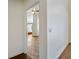Hallway featuring neutral paint, tile flooring, and views into the living room at 7264 Hawksnest Blvd, Orlando, FL 32835