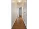 Hallway with wood floor and white doors at 7264 Hawksnest Blvd, Orlando, FL 32835