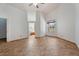 Well-lit living room featuring tile flooring, an access door and a large window at 7264 Hawksnest Blvd, Orlando, FL 32835