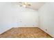 Bright living room with a high ceiling, tile flooring, and two access doors at 7264 Hawksnest Blvd, Orlando, FL 32835