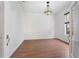 Bright, open living room with hardwood floors, neutral walls, and decorative Tiffany style lighting fixture at 7264 Hawksnest Blvd, Orlando, FL 32835
