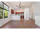 Spacious living room is adjacent to kitchen with breakfast bar at 7264 Hawksnest Blvd, Orlando, FL 32835