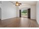 Bright, spacious living room with hardwood floors and large sliding glass doors to the outdoor area at 7264 Hawksnest Blvd, Orlando, FL 32835