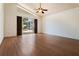 Spacious living room with vaulted ceilings, hardwood floors, and sliding glass doors to the patio at 7264 Hawksnest Blvd, Orlando, FL 32835