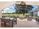 Spacious screened porch with comfortable seating and golf course views at 7264 Hawksnest Blvd, Orlando, FL 32835