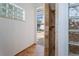 Tiled shower opens to the outside and features glass block accents at 7264 Hawksnest Blvd, Orlando, FL 32835