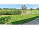 View of the manicured landscaping and sprawling green spaces surrounding the property at 7409 Excitement Dr, Reunion, FL 34747