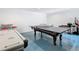 A game room featuring a ping pong table, foosball table, and air hockey table at 7409 Excitement Dr, Reunion, FL 34747