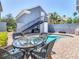 Inviting outdoor pool area with brick pavers, outdoor seating, and a backyard pool at 7409 Excitement Dr, Reunion, FL 34747