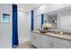 Bright, well-appointed bathroom with double vanity and a walk-in shower at 756 Mocking Jay Ln, St Cloud, FL 34771