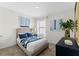 Cozy bedroom with blue accents, plush carpet, and natural light at 756 Mocking Jay Ln, St Cloud, FL 34771