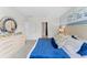 Bright, comfortable bedroom with soft colors, plush bedding, and modern decor at 756 Mocking Jay Ln, St Cloud, FL 34771