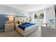Comfortable and bright bedroom with soft colors, plush bedding, and lots of natural light at 756 Mocking Jay Ln, St Cloud, FL 34771