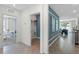 Hallway view leading to a bright office with an adjacent laundry room and living space at 756 Mocking Jay Ln, St Cloud, FL 34771