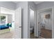 Hallway view of bedroom and bathroom featuring modern color schemes at 756 Mocking Jay Ln, St Cloud, FL 34771