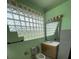 Bathroom with glass block window allowing natural light at 8129 Granada Blvd, Orlando, FL 32836