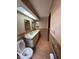 This bathroom features a vanity, toilet, tile backsplash, and grab bars at 8129 Granada Blvd, Orlando, FL 32836