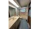 Bright bathroom features a sink and vanity, and combination tub/shower at 8129 Granada Blvd, Orlando, FL 32836