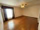 Primary bedroom with hardwood floors and ceiling fan at 8129 Granada Blvd, Orlando, FL 32836