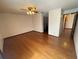 Spacious bedroom with ceiling fan and hardwood floors at 8129 Granada Blvd, Orlando, FL 32836
