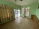 Bedroom offering a view of the pool and access to other rooms through glass block windows at 8129 Granada Blvd, Orlando, FL 32836