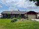 Charming single-story home with stone accents and a well-manicured front yard at 8129 Granada Blvd, Orlando, FL 32836