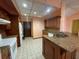 Bright kitchen with granite countertops and white appliances at 8129 Granada Blvd, Orlando, FL 32836