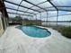 Beautiful in-ground screened pool with a view of the lake at 8129 Granada Blvd, Orlando, FL 32836