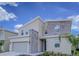Stunning front exterior showing modern two-story architecture and stone accents at 8844 Cabot Cliffs Dr, Davenport, FL 33896