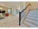 Inviting living room view from staircase showcasing the stylish decor and layout of the space at 8844 Cabot Cliffs Dr, Davenport, FL 33896