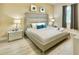 Comfortable main bedroom with a large bed, side tables, and plenty of natural light at 8844 Cabot Cliffs Dr, Davenport, FL 33896