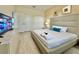 Comfortable main bedroom with a large bed, side tables, and a TV for late night enjoyment at 8844 Cabot Cliffs Dr, Davenport, FL 33896