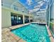 Captivating pool view showing cool blue water and screen enclosure at 8844 Cabot Cliffs Dr, Davenport, FL 33896