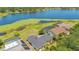 Aerial view showcasing the property, lake access and screen enclosed pool; a picturesque waterfront location at 9143 San Ambrosio, Orlando, FL 32836