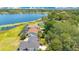 Aerial view of waterfront homes surrounded by lush trees at 9143 San Ambrosio, Orlando, FL 32836